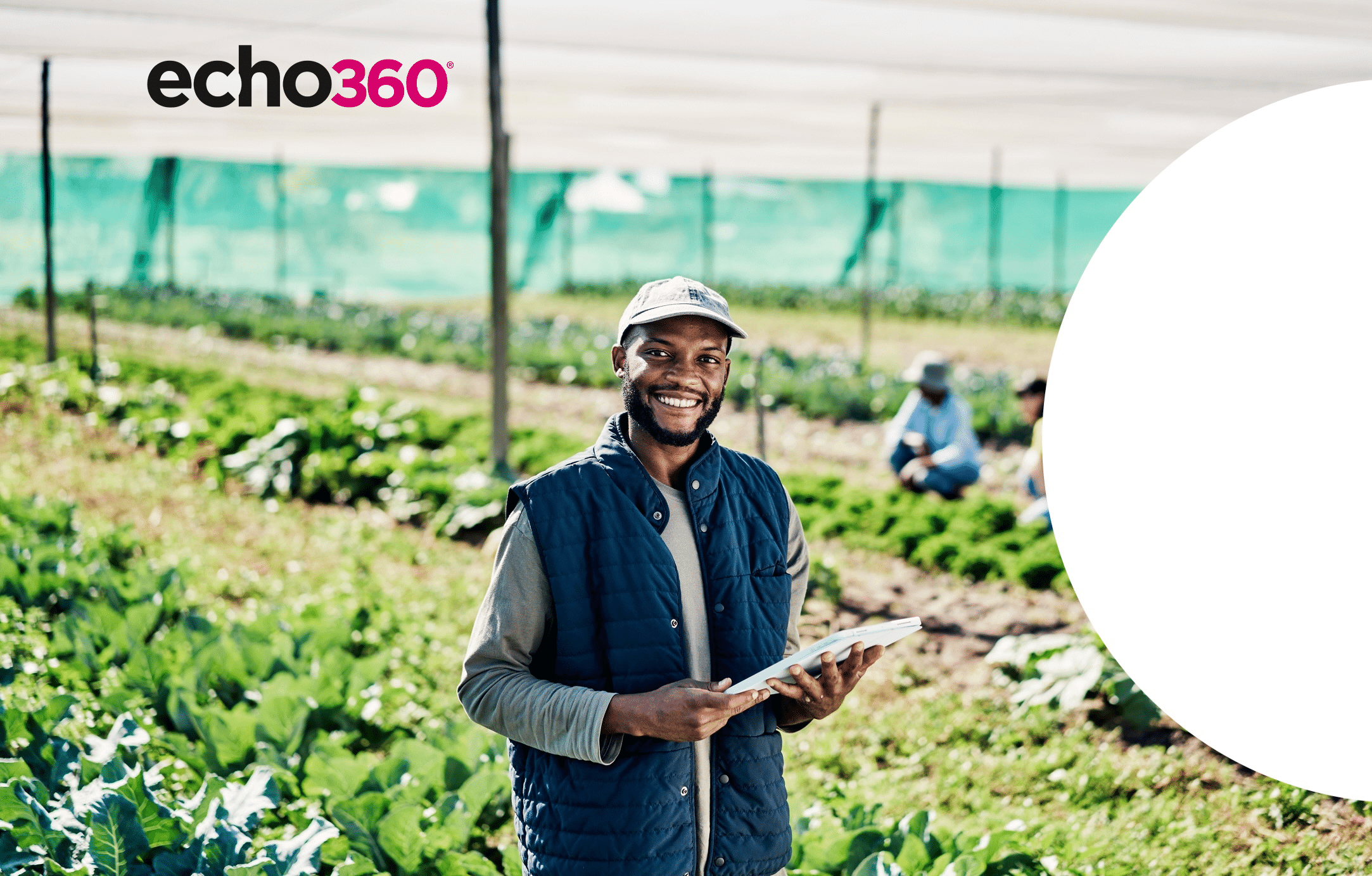 Portrait of happy young farmer using digital tablet while working on organic sustainable farm to cultivate vegetation in agribusiness. Man using technology to prepare harvest and monitor plant growth.