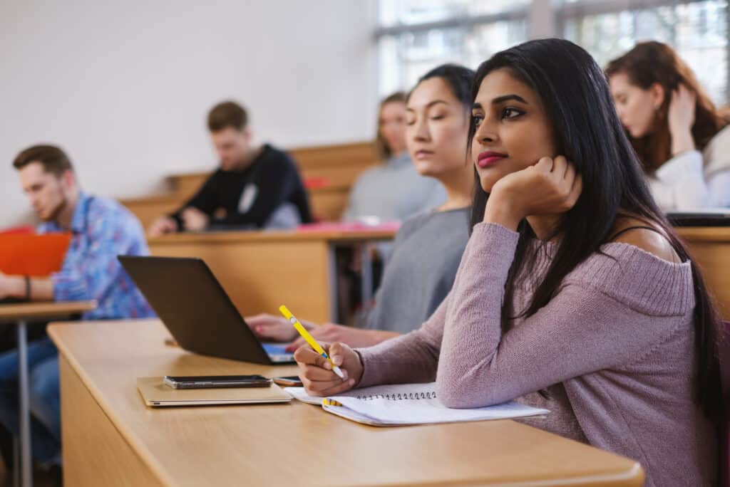 college students learning in classroom