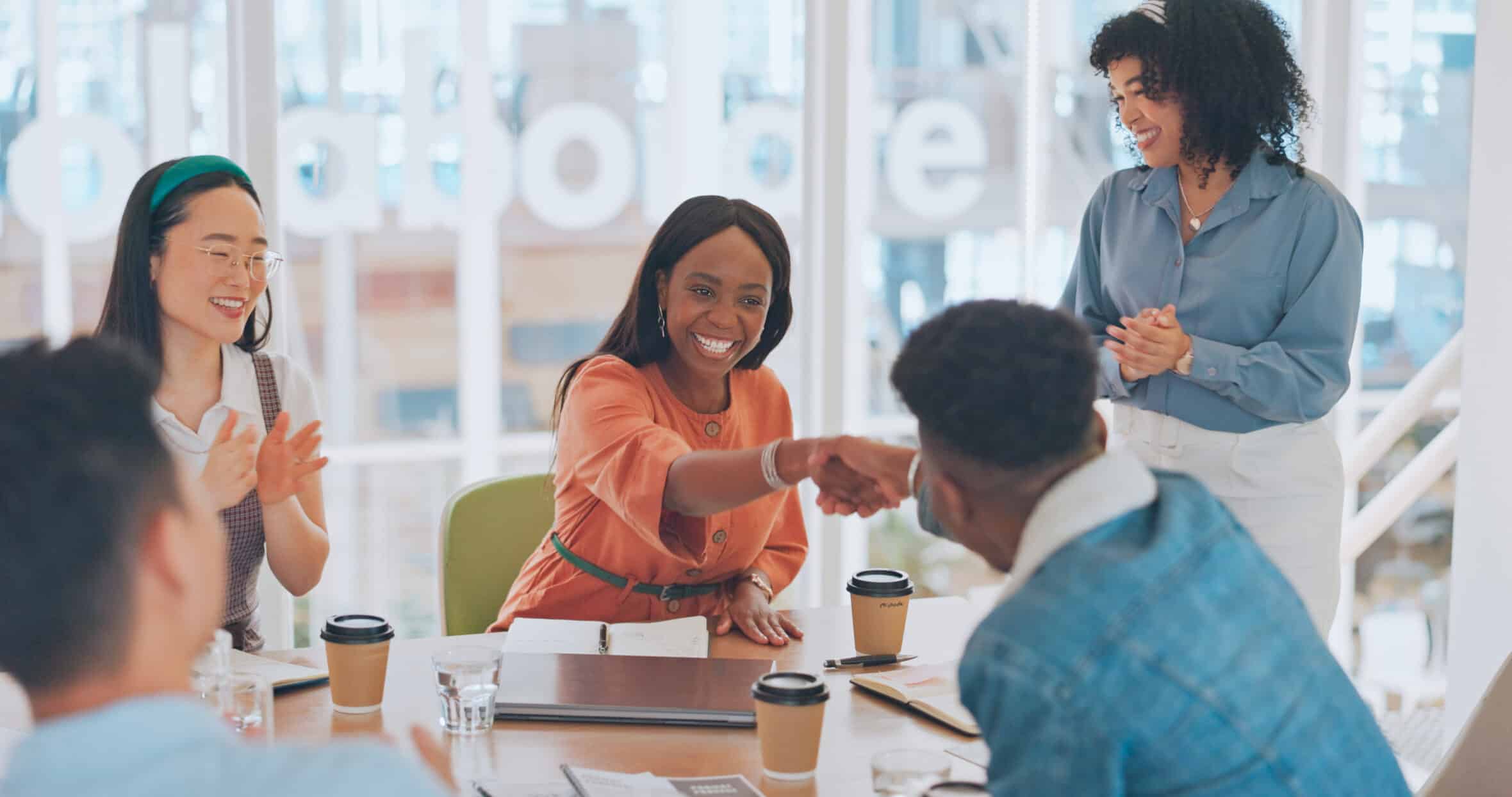 Welcome, handshake and applause with business people in meeting for onboarding, partnership and success. Deal, congratulations and achievement with employee in boardroom for planning, target and sale